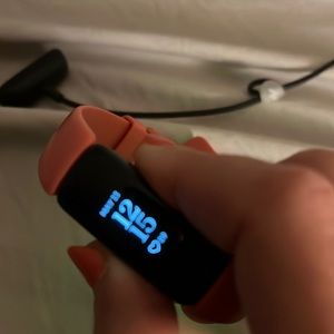 Pink Fitbit inspire 2 brand new condition no flaws with charger